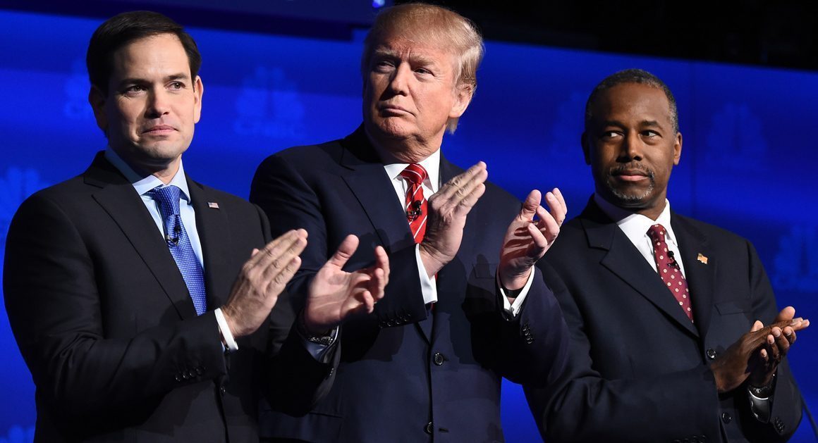 Republican presidential hopefuls (L-R) Marco Rubio, Donald Trump and Ben Carson applaud as the candidates are introduced at the start of the third Republican Presidential Debate, October 28, 2015 at the Coors Event Center at the University of Colorado in Boulder, Colorado. AFP PHOTO / ROBYN BECK (Photo credit should read ROBYN BECK/AFP/Getty Images)
