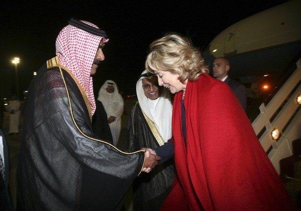 U.S. Secretary of State Hillary Clinton is greeted by a Saudi official upon her arrival at King Khaled airport in Jeddah